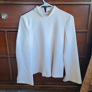 New with tags long sleeve cream in shirt.